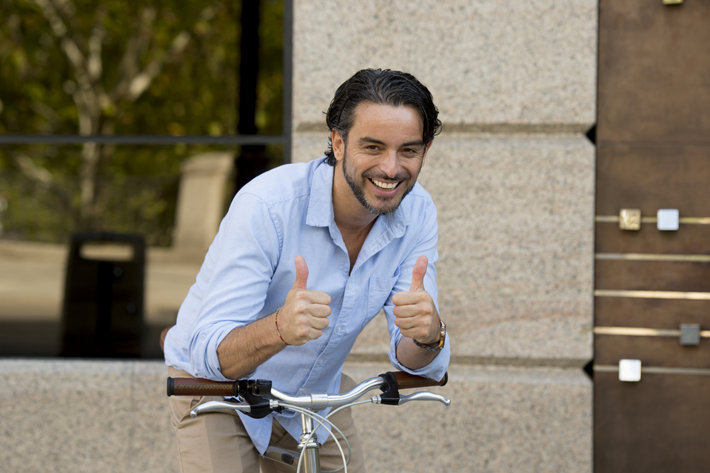 Happy man with bycicle